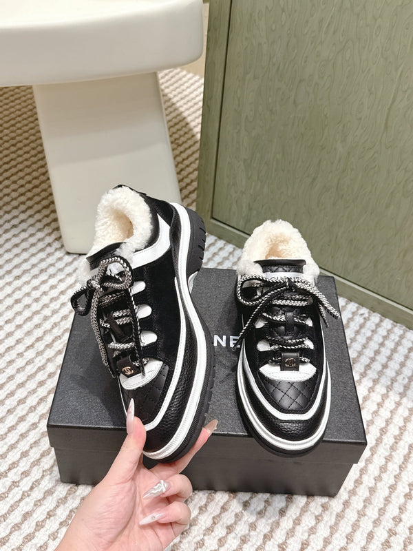 Chanel 26s Thick-Sole Sneakers In Black And White Calfskin With Fur Lining
