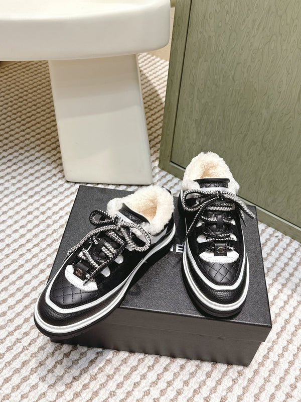 Chanel 26s Thick-Sole Sneakers In Black And White Calfskin With Fur Lining