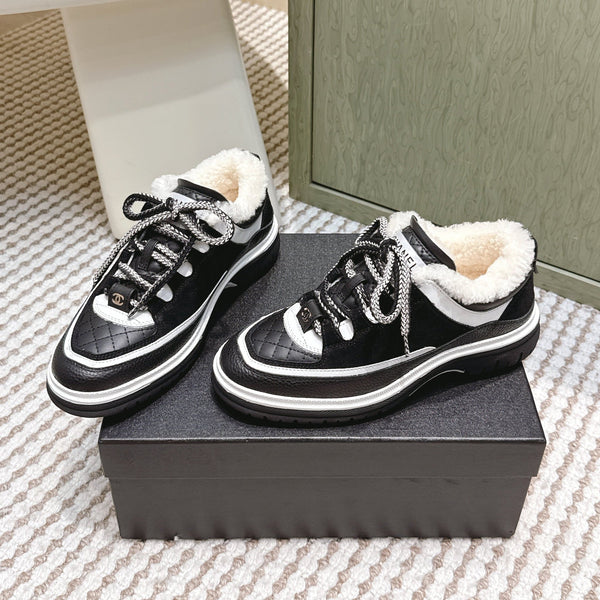 Chanel 26s Thick-Sole Sneakers In Black And White Calfskin With Fur Lining