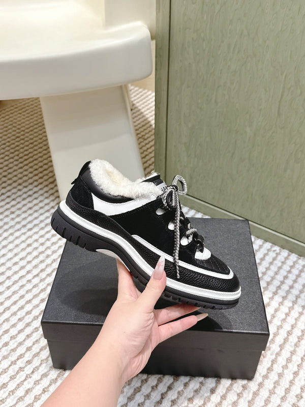 Chanel 26s Thick-Sole Sneakers In Black And White Calfskin With Fur Lining
