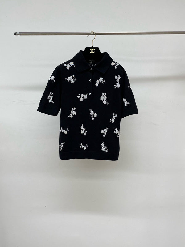 Polo Chanel 2026 en coton noir et blanc à imprimé floral