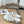 POOL GRAFFITI CROCS SLIDE SANDALS IN WHITE AND BLACK RUBBER