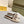 FENDI SIGNATURE MULE SLIDES IN WHITE FIBRE WITH BROWN EMBROIDERED LOGO