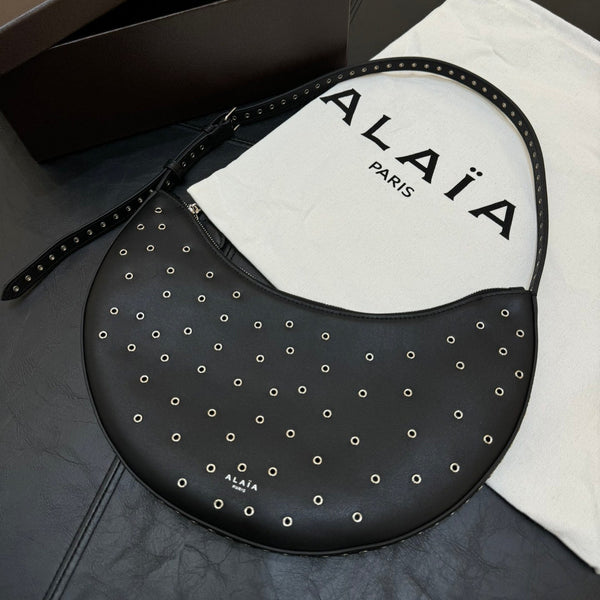 ONE PIECE DEMI LUNE BAG 31 IN BLACK SHEEPSKIN EYELET DETAILING