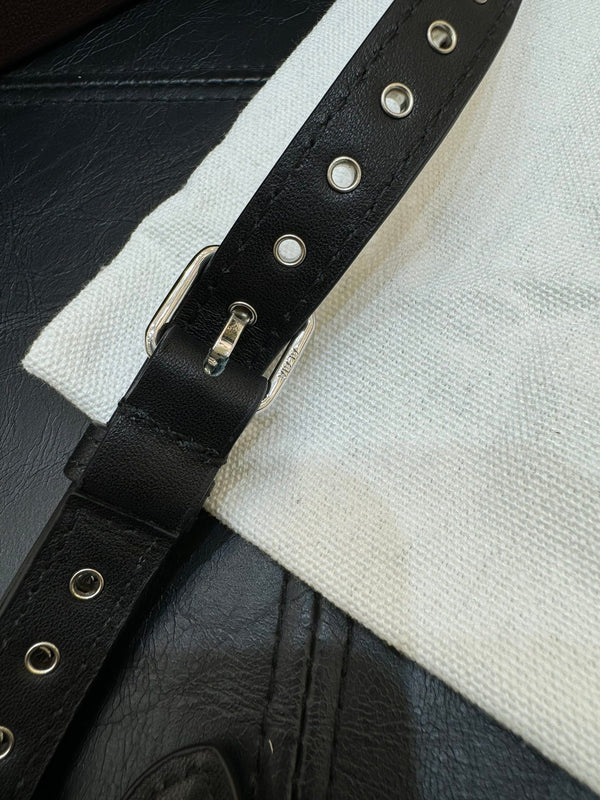 ONE PIECE DEMI LUNE BAG 31 IN BLACK SHEEPSKIN EYELET DETAILING