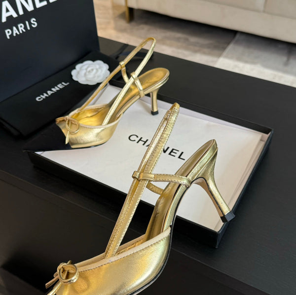 Acc slingbacks 65 bow gold metalic lambskin black grosgrain