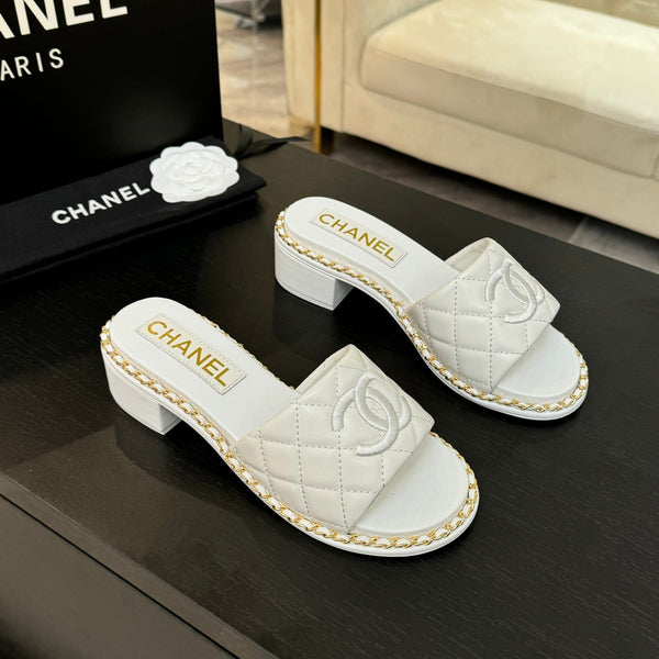 PANTOFOLA ALTE FLATFORM IN PELLE DI MONTONE GOFFRATA BIANCA