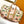 KEEPALL BANDOULIÈRE 50 IN SAND TROPICAL MOTIFS MONOGRAM SURFIN CANVAS