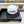 CAPPELLO A SECCHIELLO IN PELLICCIA DI AGNELLO BIANCO E NERO 430218 