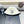 CAPPELLO A SECCHIELLO IN PELLICCIA DI AGNELLO BIANCO E NERO 431377