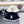 CAPPELLO A SECCHIELLO IN PELLICCIA DI AGNELLO BIANCO E NERO 431377