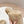 MULES CON LOGO TRIANGOLARE ATTACCATO IN SHEARLING BEIGE