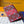 LV M26538 Portapassaporto in pelle di vacchetta rossa e nera