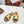TRIOMPHE SLIDE IN GOLD CALFSKIN