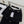 Chanel 2025 Jupe deux pièces en tissu tweed tressé noir, boucle dorée 319481