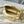 CAPUCINES EAST-WEST MINI 22 IN BANANA YELLOW TAURILLON GOLD HARDWARE