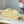CAPUCINES EAST-WEST MINI 22 IN BANANA YELLOW TAURILLON GOLD HARDWARE