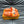 LV SLIPPERS IN CARROT ORANGE MONOGRAM CALFSKIN