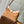 CARRYALL PM 29 IN CIDER BROWN MONOGRAM PERFORATED SUEDE AND WHITE SHEARLING TRIM
