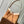 CARRYALL PM 29 IN CIDER BROWN MONOGRAM PERFORATED SUEDE AND WHITE SHEARLING TRIM
