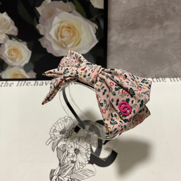 CERCHIETTO IN TESSUTO FLOREALE ROSA CHIARO 385853