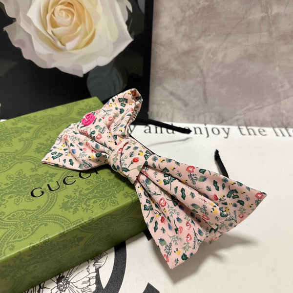 CERCHIETTO IN TESSUTO FLOREALE ROSA CHIARO 385853