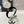 CERCHIETTO IN VELLUTO NERO CON LOGO ORO 423596