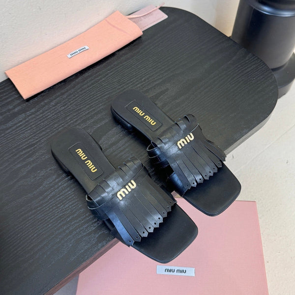 Miu 26s Flat Slippers In Black Calfskin