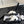 cross puffy slippers white black lycra fabric
