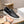 Slip-on da uomo GG in pelle di vitello goffrata nera 518844