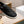 Slip-on da uomo GG in pelle di vitello goffrata nera 518844