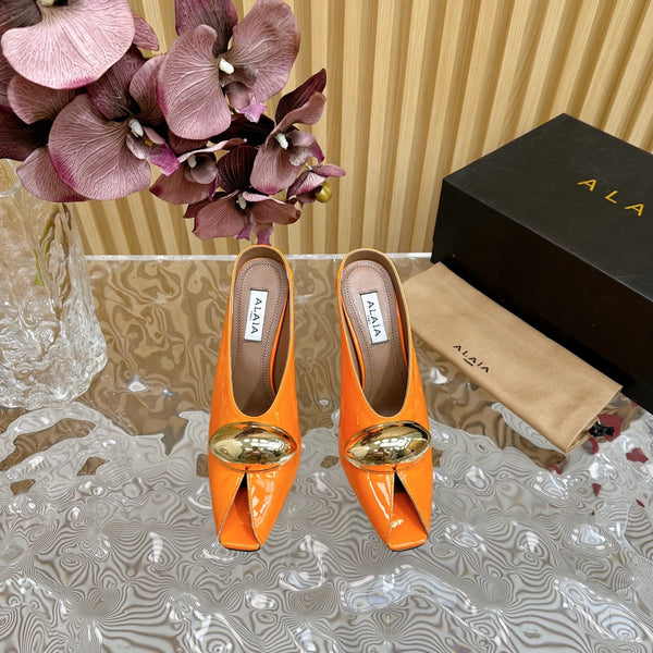 DÉCOLLETÉ ALAIA AZZEDINE IN PELLE DI VITELLO ARANCIONE MANDARINO CON FERRAMENTA ORO