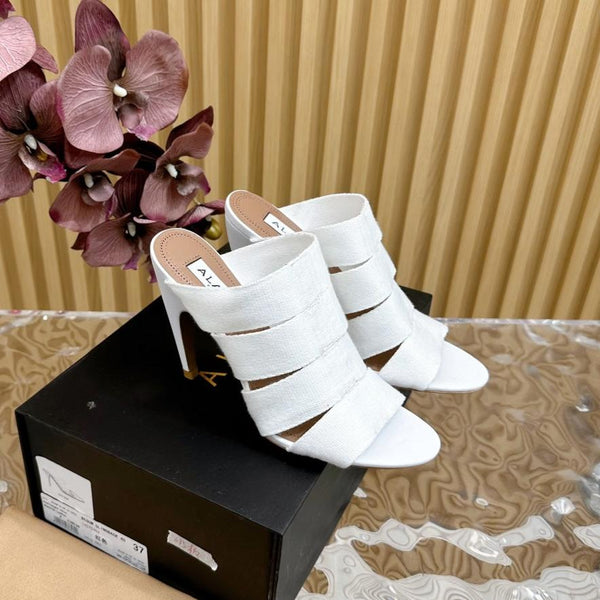 SANDALI ALAIA ELASTIC CAGE MULE IN CINTURINO INTRECCIATO BIANCO E PELLE DI AGNELLO