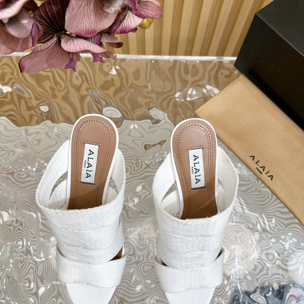 SANDALI ALAIA ELASTIC CAGE MULE IN CINTURINO INTRECCIATO BIANCO E PELLE DI AGNELLO