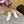 SANDALI ALAIA ELASTIC CAGE MULE IN CINTURINO INTRECCIATO BIANCO E PELLE DI AGNELLO