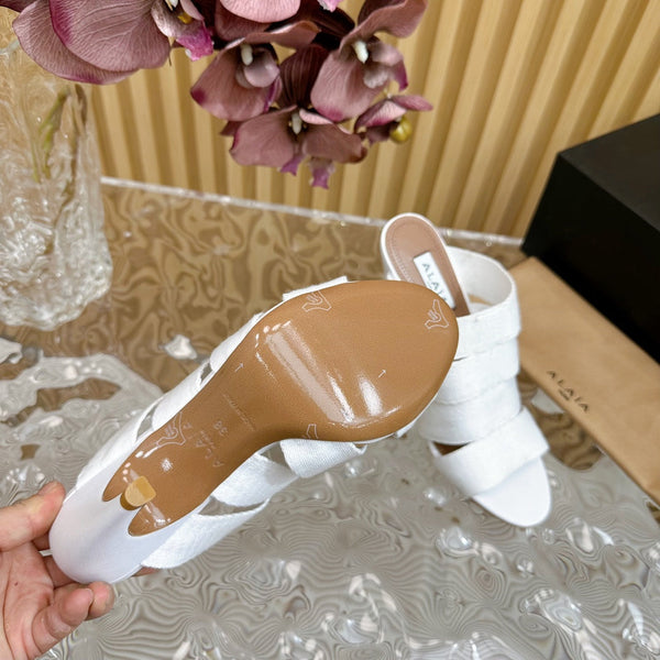 SANDALI ALAIA ELASTIC CAGE MULE IN CINTURINO INTRECCIATO BIANCO E PELLE DI AGNELLO