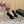 GREEN GEM-STUDDED HIGH PUMPS IN BLACK PATENT CALFSKIN