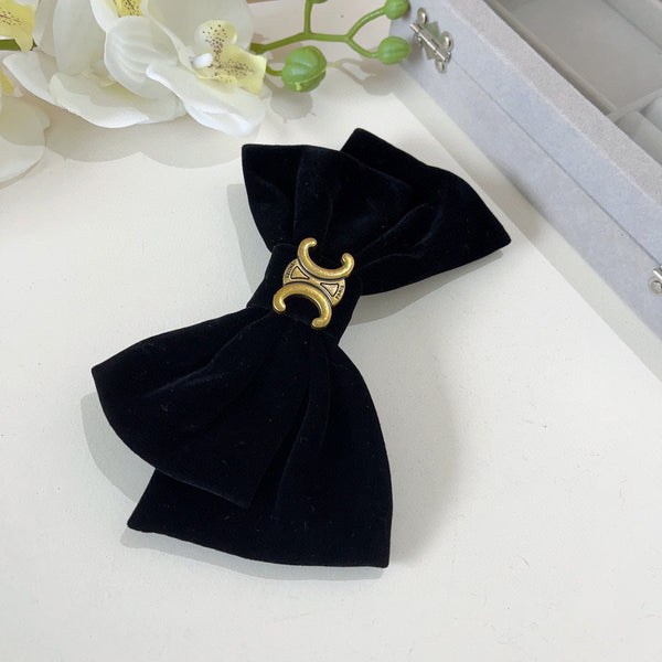 FORCINA IN VELLUTO NERO CON LOGO ORO 387059