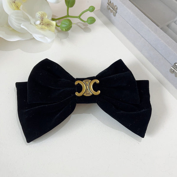 FORCINA IN VELLUTO NERO CON LOGO ORO 387059