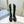 KNEE BOOTS WITH TRIANGLE LOGO IN BLACK CALFSKIN