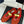 ALAIA MARY JANE SHOES IN CHERRY RED MESH WITH GOLD HARDWARE