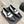 Mocassins à double boucle C en cuir de veau noir et blanc CC 25s 557705