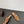MULES ALAIA FLAT IN RETE MARRONE RAME