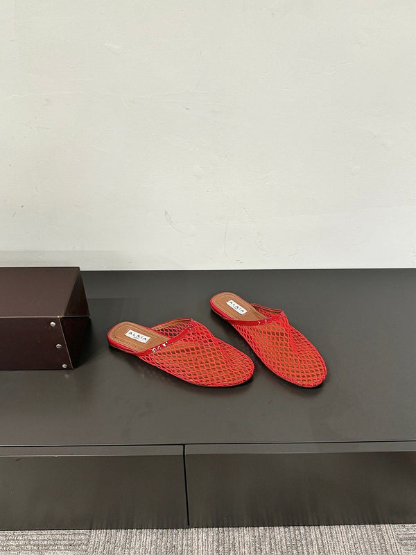 ALAIA FLAT MULES IN CHERRY RED MESH FISHNET