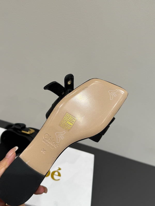 Loewe 25 Bow Metal Buckle Slide Nero Pelle di vacchetta