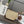 Loewe Pochette Slit en raphia beige et veau marron