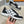 LV TRAINERS IN BLACK CALFSKIN AND WHITE JACQUARD