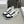 TRAINER LOW LACE-UP SNEAKER IN CALFSKIN, LAMINATED CALFSKIN AND SUEDE CALFSKIN OPTIC BLACK WHITE