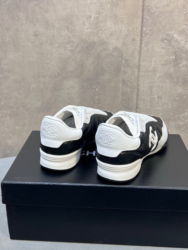 Chanel 26s Sneakers In Black And White Quilted Calfskin CC Logo