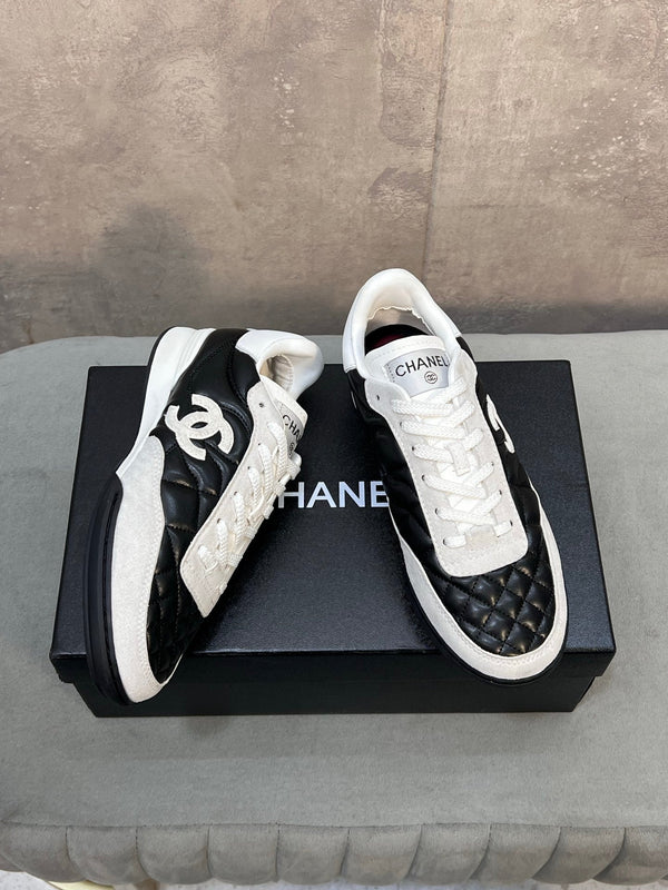 Chanel 26s Sneakers In Black And White Quilted Calfskin CC Logo